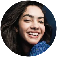 Smiling young adult female patient after treatment